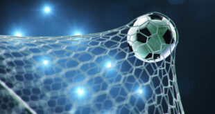 Soccer ball flew into the goal. Soccer ball bends the net, against the background of flashes of light. Soccer ball in goal net on blue background. A moment of delight, 3D illustration