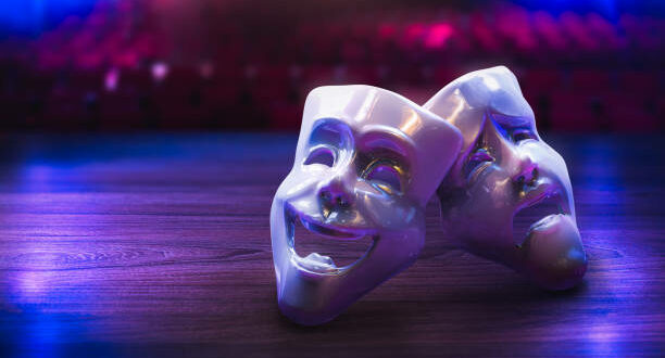 Theater masks, drama and comedy on a dark background